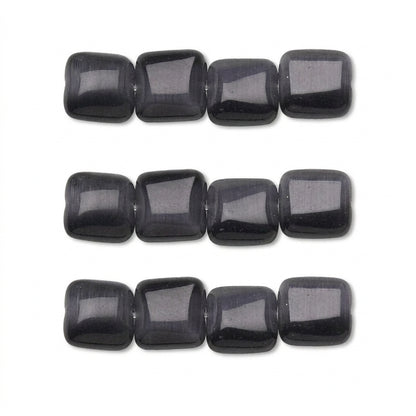Three horizontal strands of polished black rectangular beads with rounded corners, shown against a plain white background.