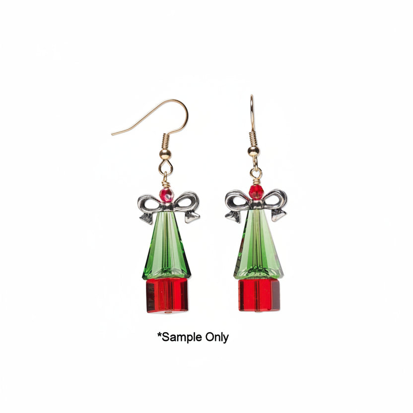 A pair of dangling earrings with gold-tone hooks, silver bow details, and faceted green and red crystal shapes resembling holiday ornaments, shown on a white background with '*Sample Only' text below.