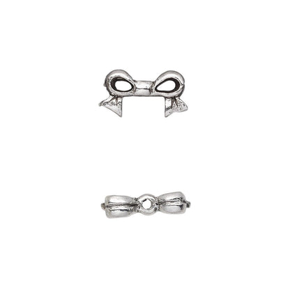 A pair of silver-toned metal bow charms shown from two angles (top and side views) on a plain white background.