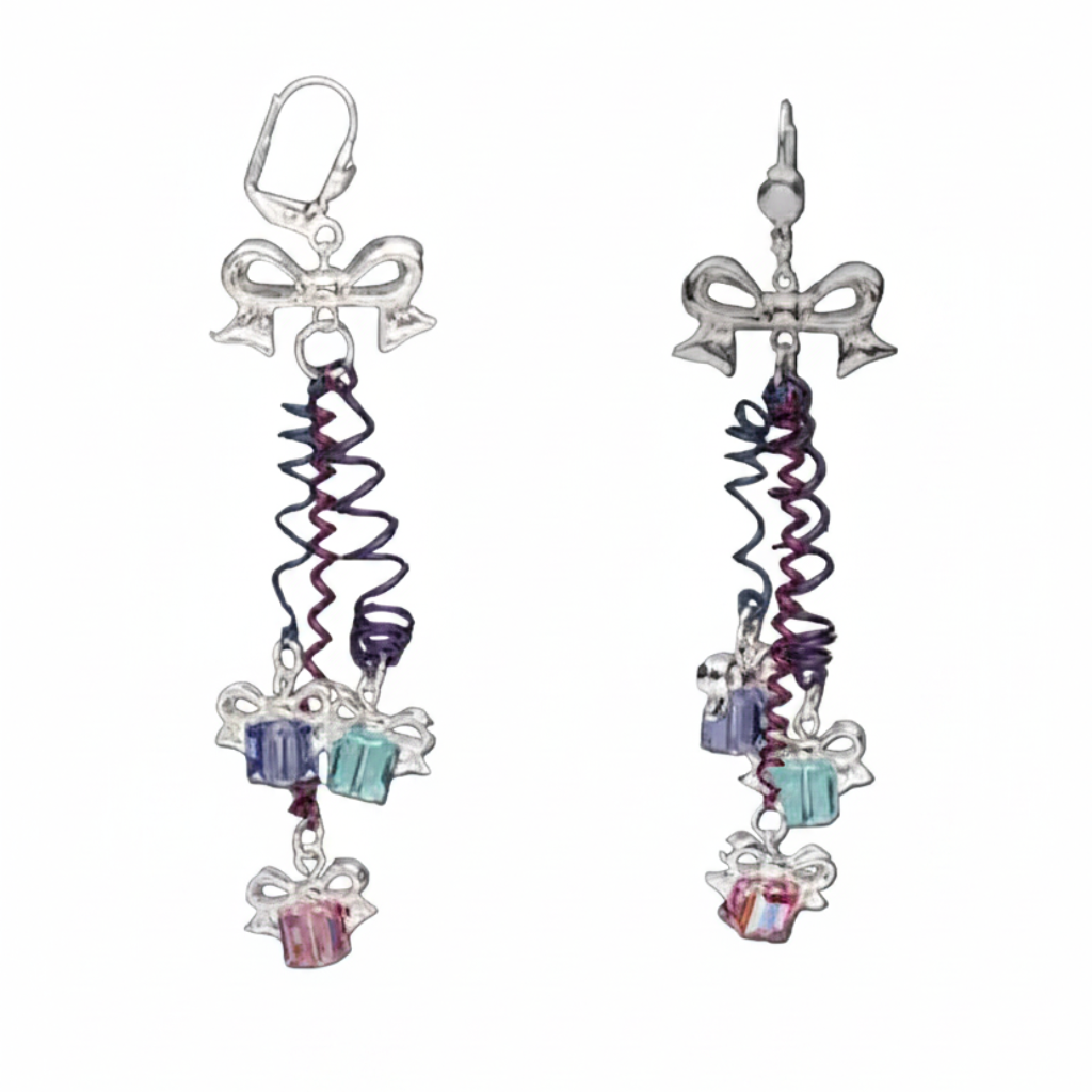 A pair of dangling earrings shown on a plain gray background, with one earring displayed normally and a smaller inset view showing the back hook detail. The earrings have silver-toned bow charms, spiral purple and blue wire strands, and dangling gift box charms in blue, aqua, and pink.