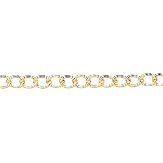 A close-up of a polished yellow gold curb chain with interlocking oval links, shown horizontally against a plain white background.