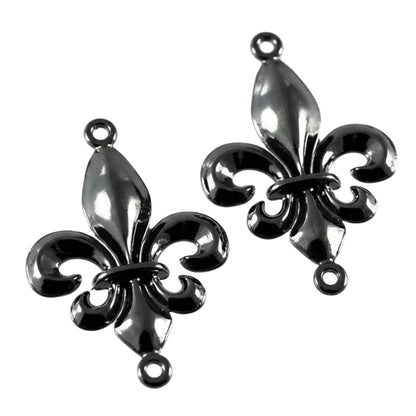 Two black metallic fleur-de-lis jewelry charms with hanging loops, shown on a plain white background.
