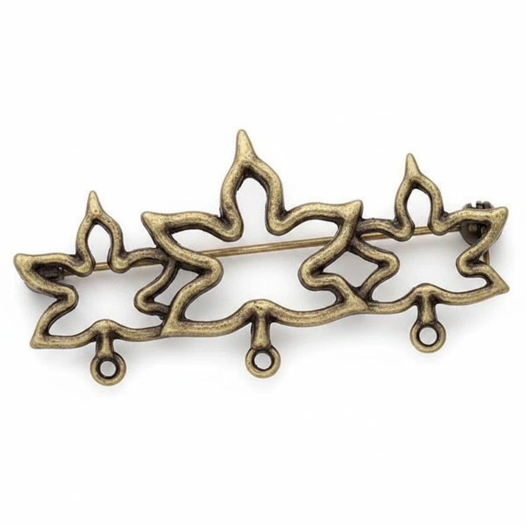 An ornate metal decorative piece with a three-pointed flame or lotus-like silhouette, finished in an antique bronze or gold-toned metallic finish, shown on a plain white background.