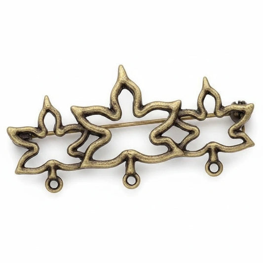 An ornate metal decorative piece with a three-pointed flame or lotus-like silhouette, finished in an antique bronze or gold-toned metallic finish, shown on a plain white background.
