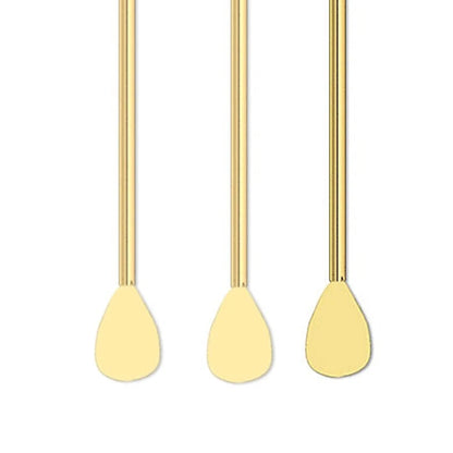 Three gold metal swab sticks with oval-shaped heads, arranged horizontally in a row on a plain white background.