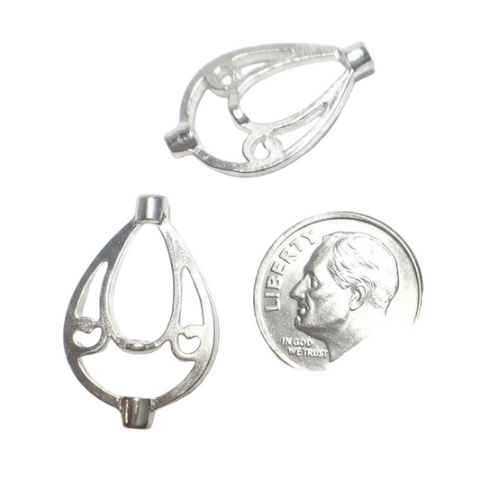 Two silver metal jewelry findings or clasps shown on a white background, with a U.S. dime included for size reference.