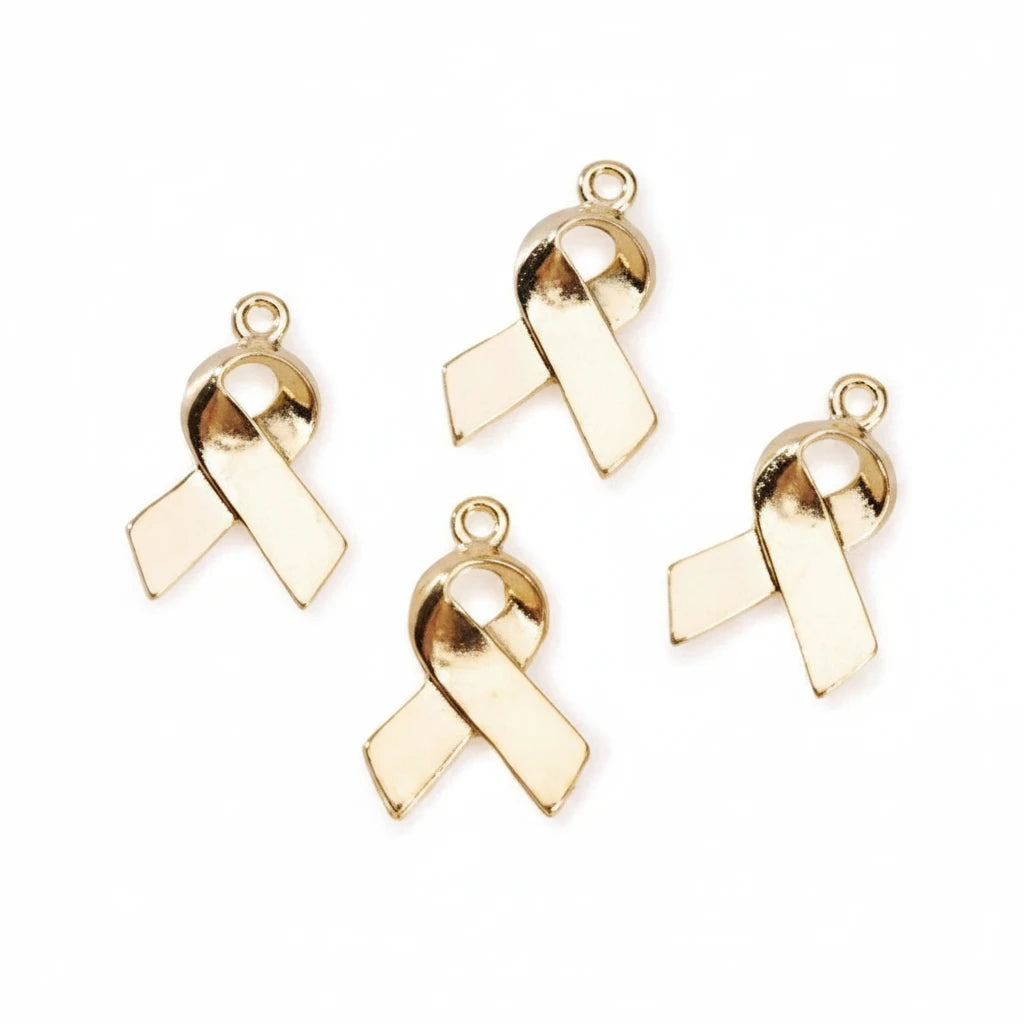 Four gold awareness ribbon charms with top loops, arranged on a plain white background.