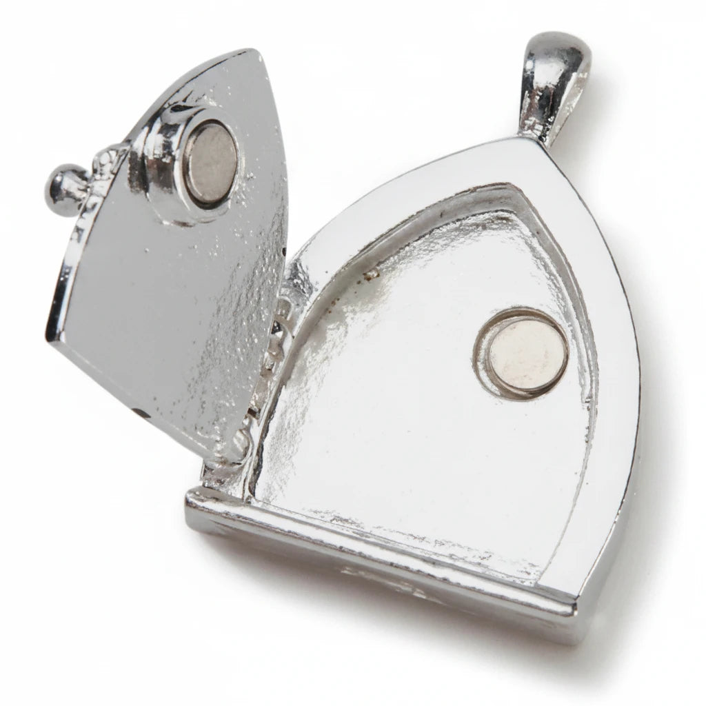 A silver-toned metal pendant shaped like a house with a circular inset detail, shown on a plain white background.
