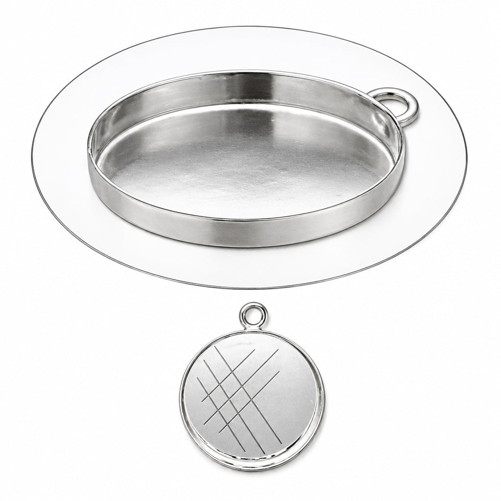Silver oval bezel setting with a small loop at the top, shown above a matching round engraved silver pendant charm on a white background.