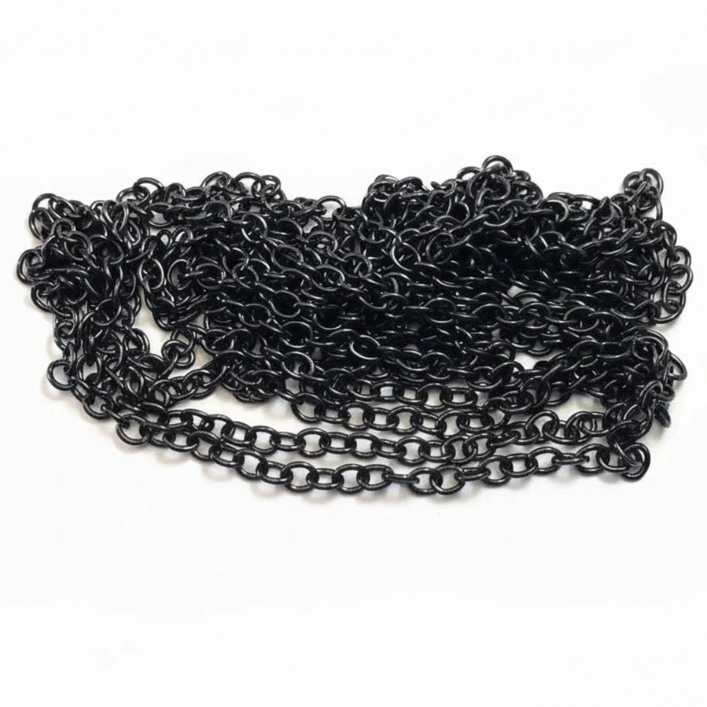 A coiled length of black metal chain links, shown next to a US quarter coin for scale, on a plain white background.