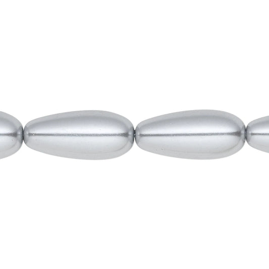 A close-up of a metallic silver beaded strand, showing smooth, elongated teardrop-shaped beads on a plain white background.
