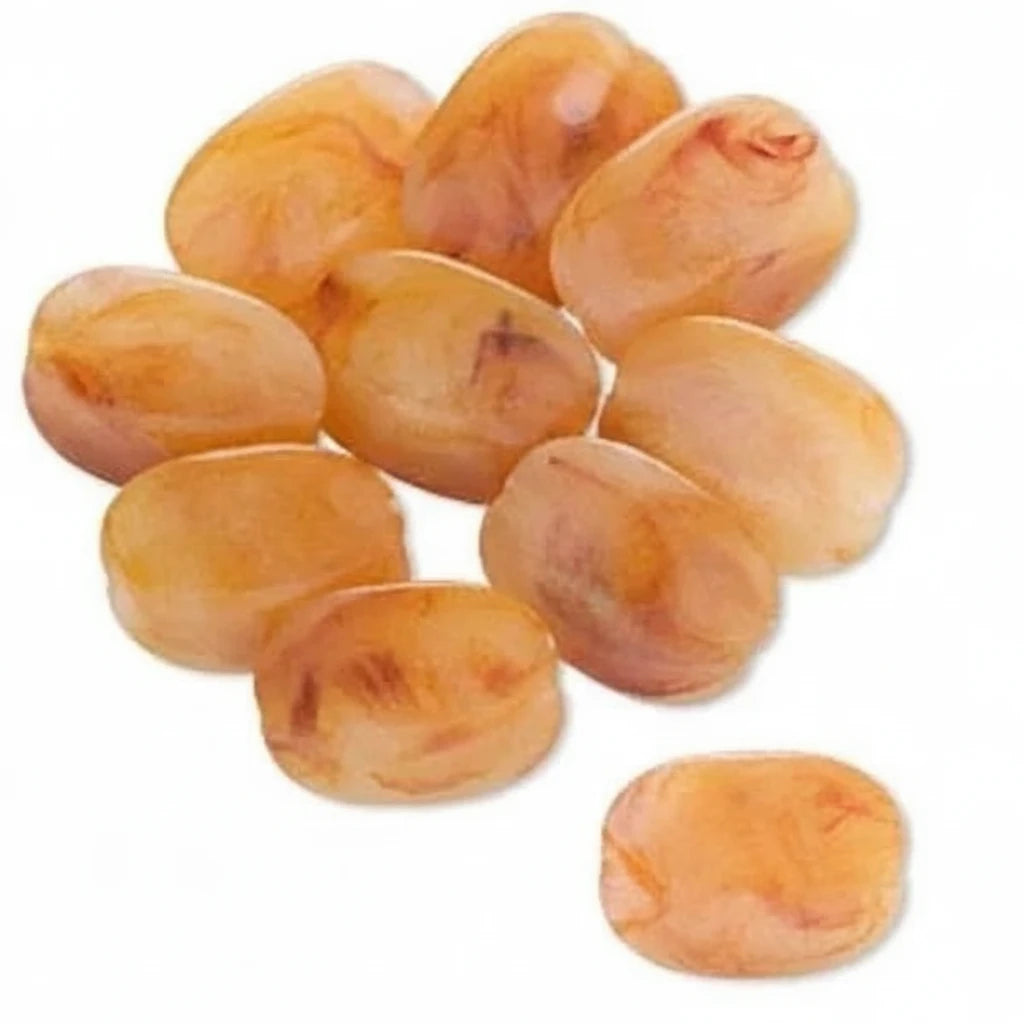 A pile of small, oval-shaped amber-colored resin beads or cabochons on a plain white background, with one bead shown separately at the bottom right.