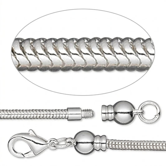 Silver-toned snake chain necklace with a lobster clasp, decorative bead, and split ring clasp, shown with a close-up circular inset of the chain texture.