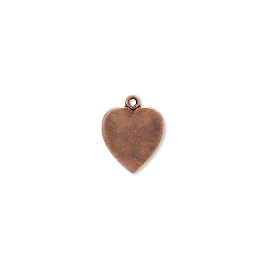 A small heart-shaped metal charm with a textured, antique copper finish and a top loop, centered on a plain white background.