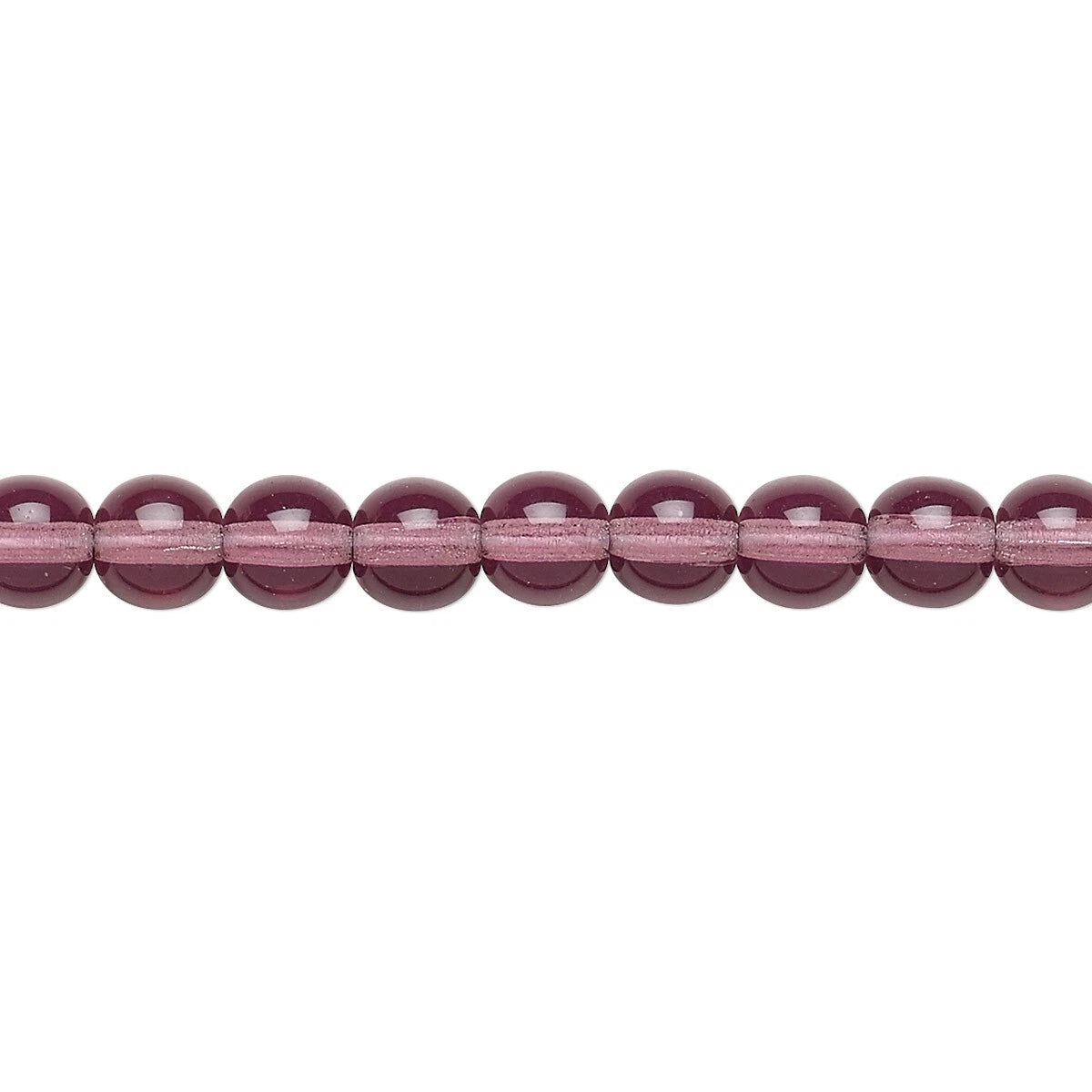 A close-up horizontal line of faceted round beads in a translucent dusty rose or mauve color, set against a plain white background.