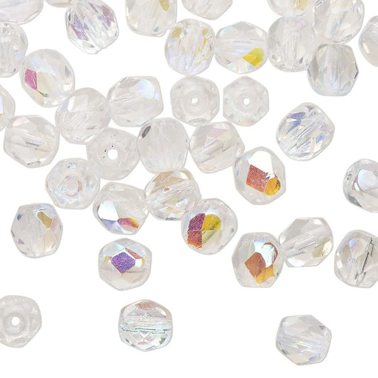 Clear faceted round GLASS beads with iridescent AB coating, scattered on a white background.
