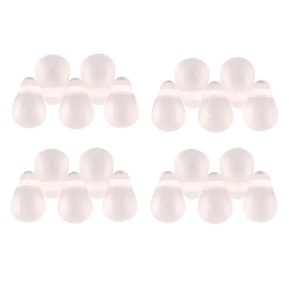 Four pairs of small, translucent, pale pink silicone or plastic dome-shaped beads arranged in a grid on a plain white background.
