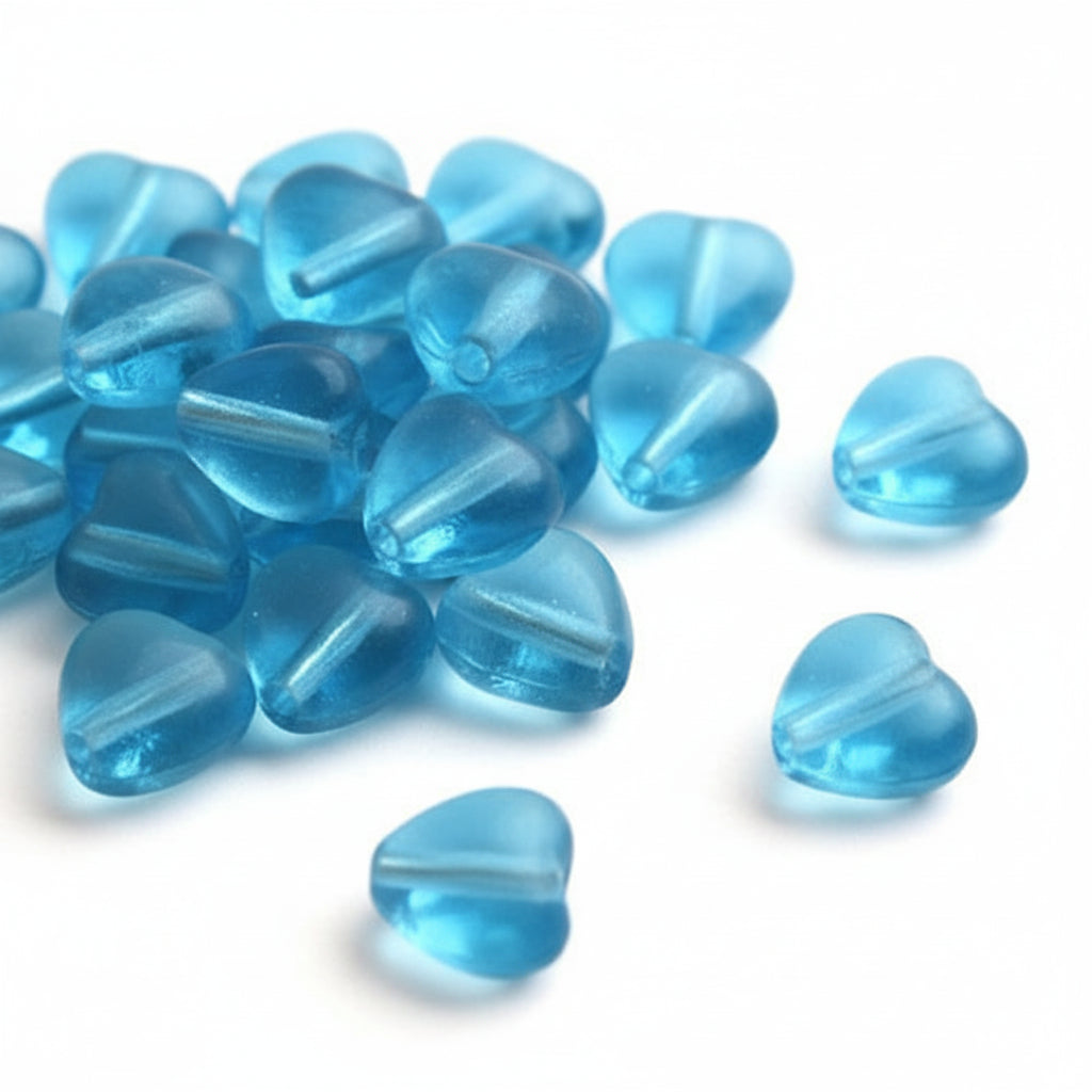 Light blue translucent heart-shaped glass beads strung on a wire, shown against a plain white background.