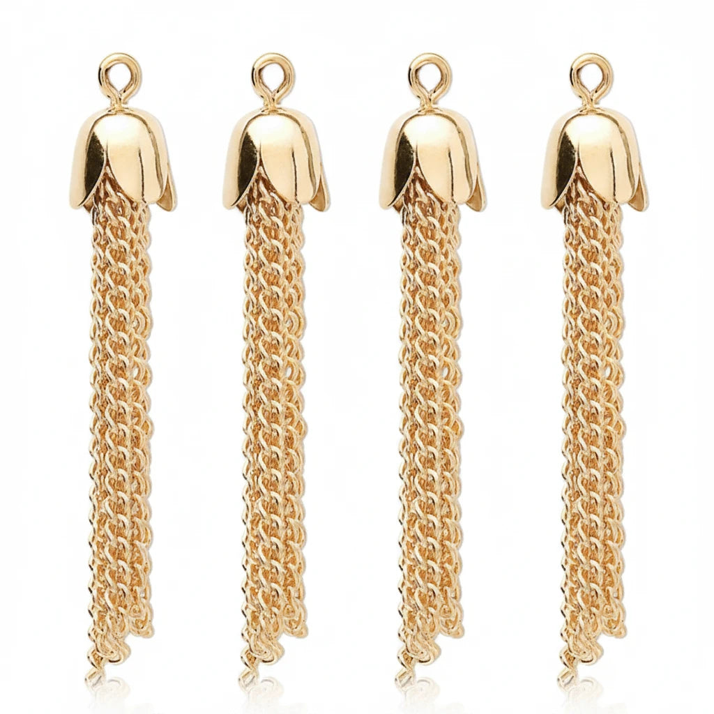 Four gold-tone flower-shaped pendant charms with long dangling chain tassels, shown on a plain white background.