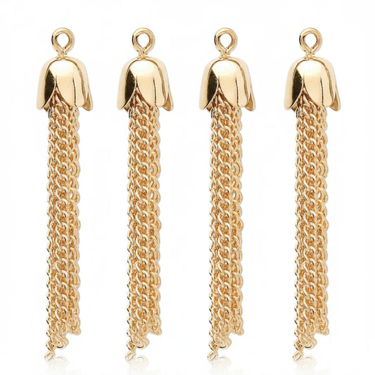 Four gold-tone flower-shaped pendant charms with long dangling chain tassels, shown on a plain white background.