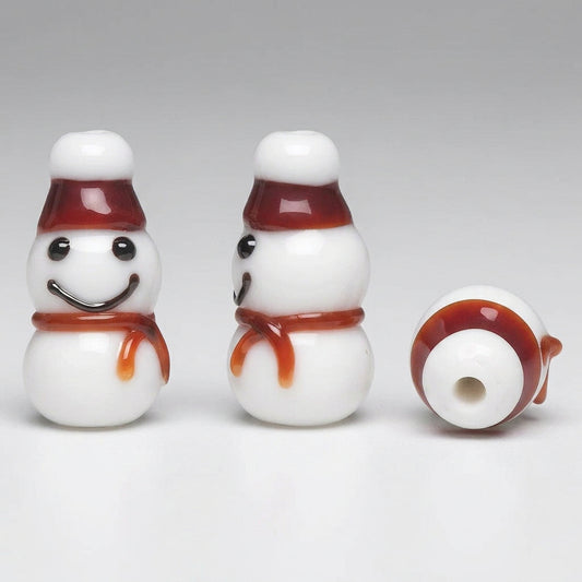 Three views of a small snowman-shaped bead or charm on a plain white background: one front view with a smiling face, one side view, and one top-down circular view showing the back side.