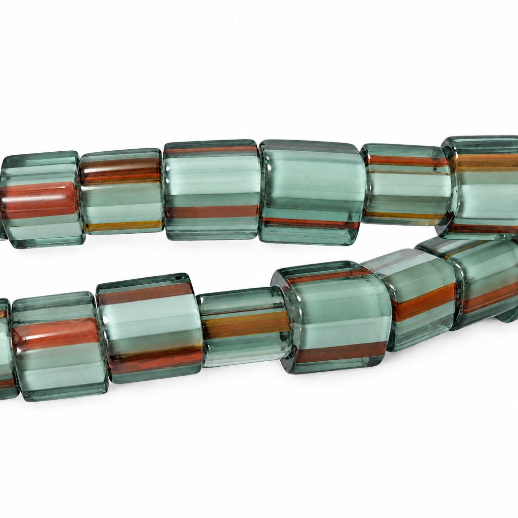 Chunky translucent square beads with horizontal stripes of smoky gray, teal green, and rust orange, arranged in two strands on a white background.