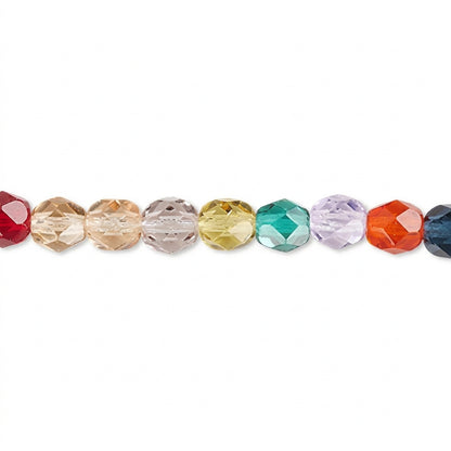 A close-up horizontal row of faceted round beads in assorted colors including red, peach, clear, yellow, green, lavender, orange, and dark blue, set against a plain white background.