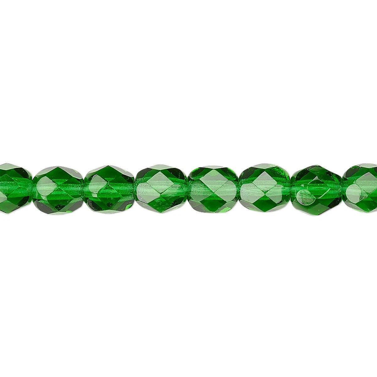 A close-up horizontal shot of faceted green glass beads on a plain white background.