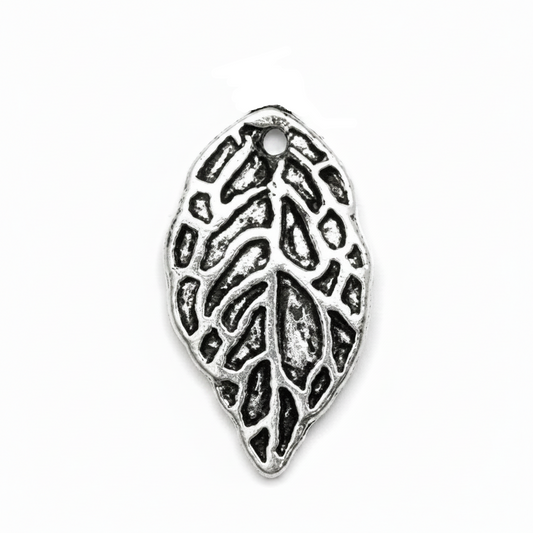 An antique silver leaf-shaped jewelry charm with an embossed leaf pattern and a top loop, shown on a plain white background.