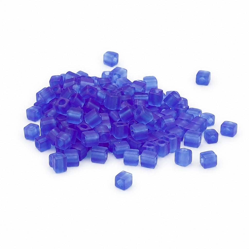 Blue beads scattered on a white background
