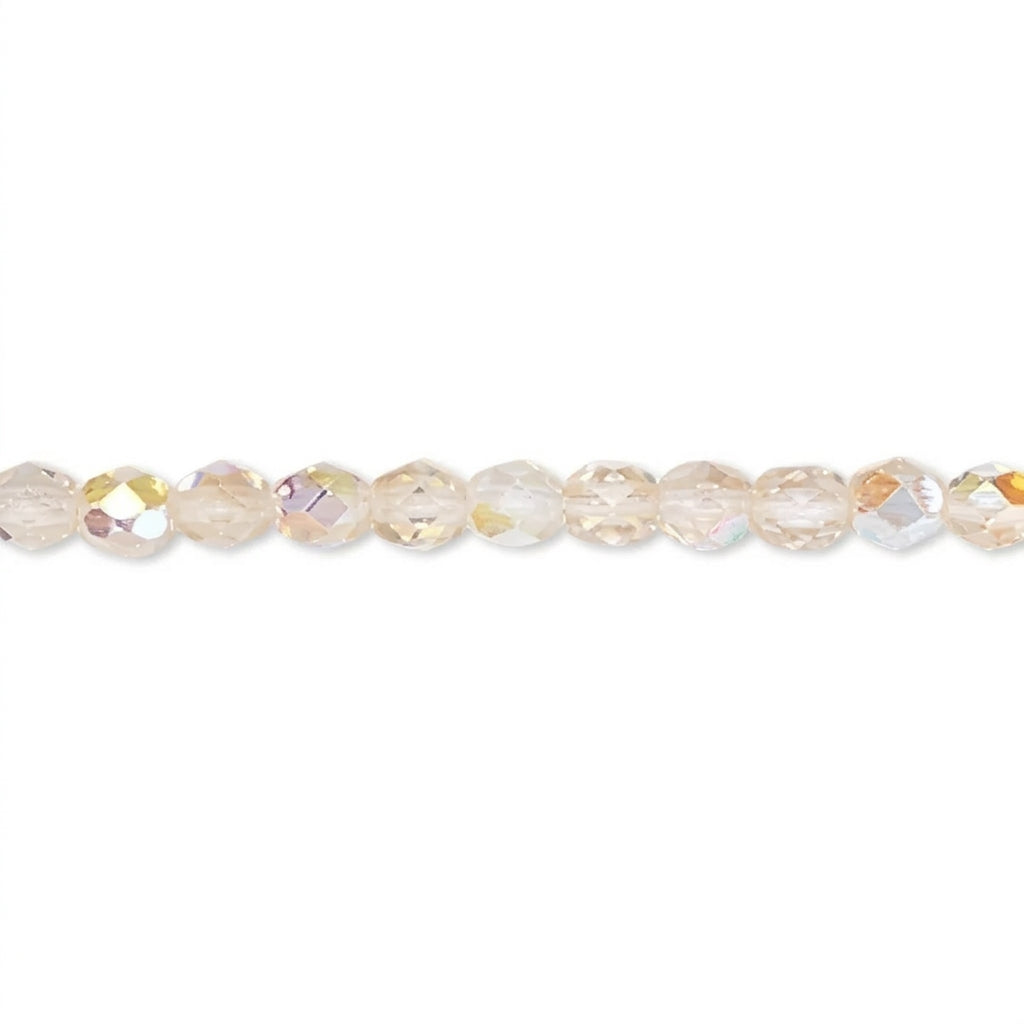 A strand of faceted round beads in a warm champagne or pale gold iridescent finish, shown against a plain white background.