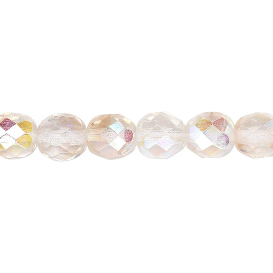 A close-up horizontal strand of faceted round beads with an iridescent, pale pink and gold Aurora Borealis finish, set against a solid white background.
