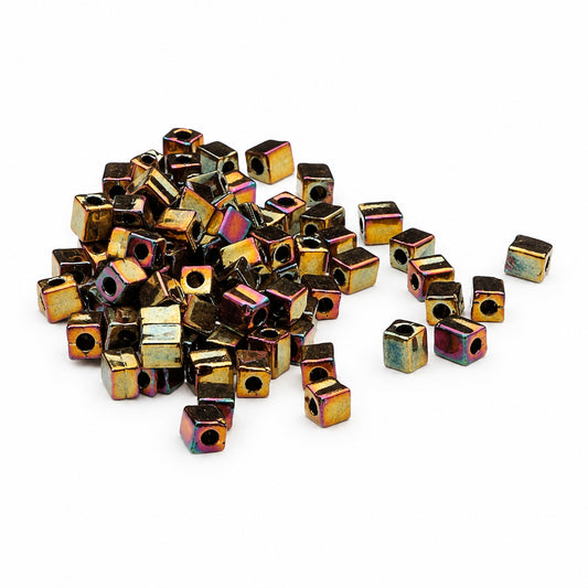 Multicolored cube-shaped beads on a white background