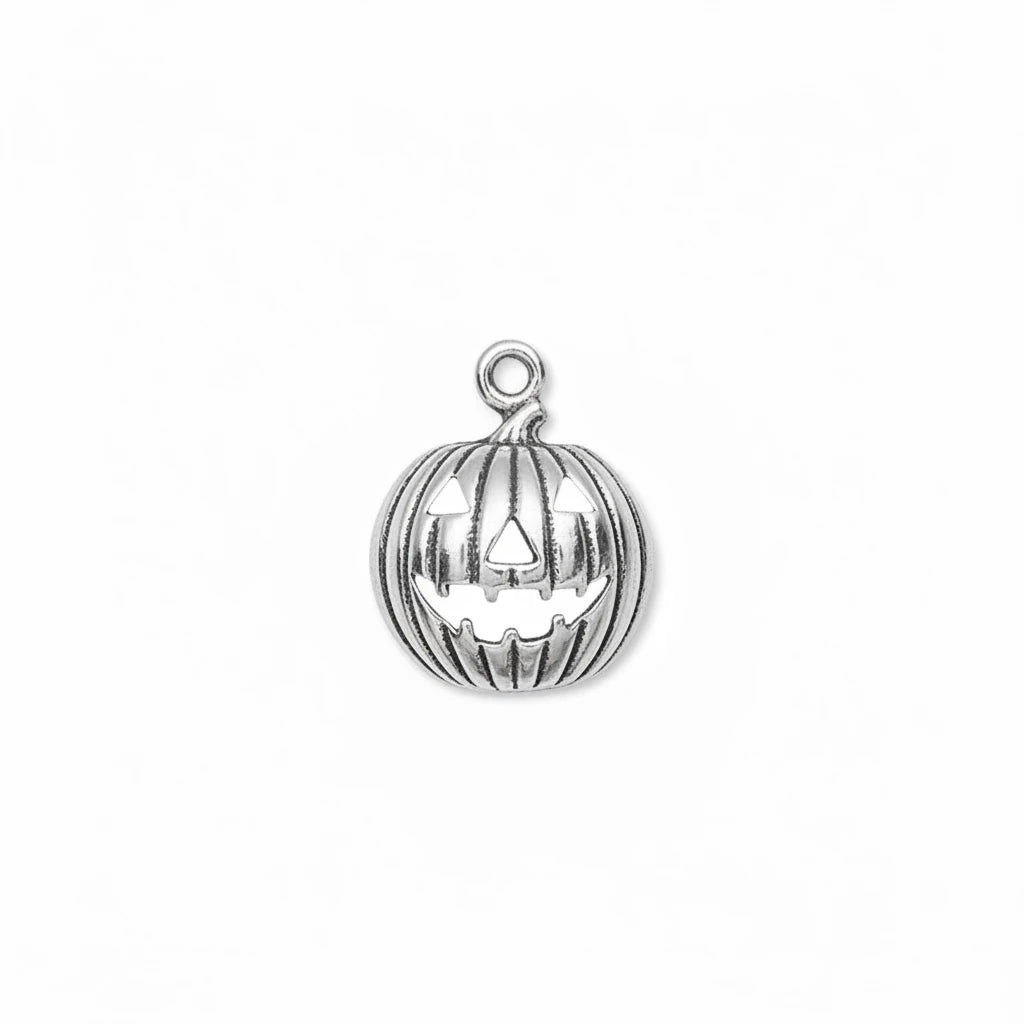 A silver pumpkin-shaped pendant charm with a carved jack-o'-lantern face and a top loop, shown on a plain white background.