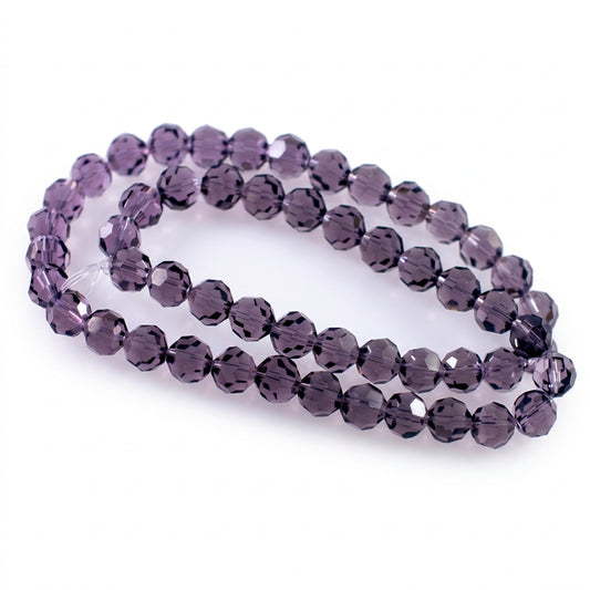 A strand of faceted  beads with a subtle purple tint, arranged in two loops on a plain white background.