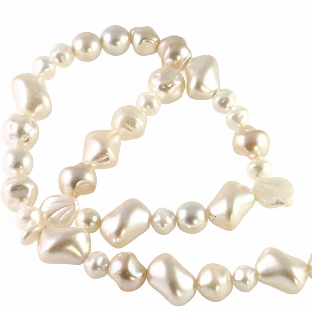A strand of irregular, baroque-style white pearls with a glossy finish, arranged in loose loops on a plain white background.