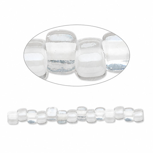 Clear glass seed beads with a rounded square shape, shown in a close-up oval detail view and as a single strand against a white background.