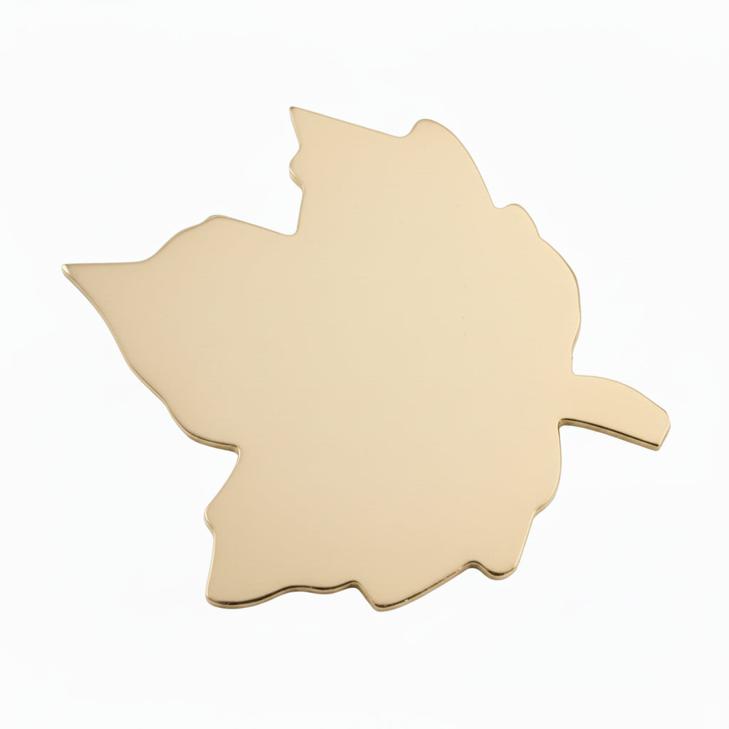 Unpainted wooden leaf-shaped cutouts shown on a white background, with a penny placed near them for scale.