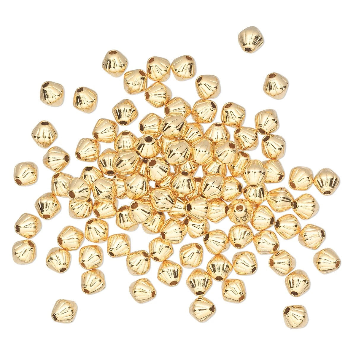 A pile of small metallic gold bell-shaped beads scattered on a plain white background.