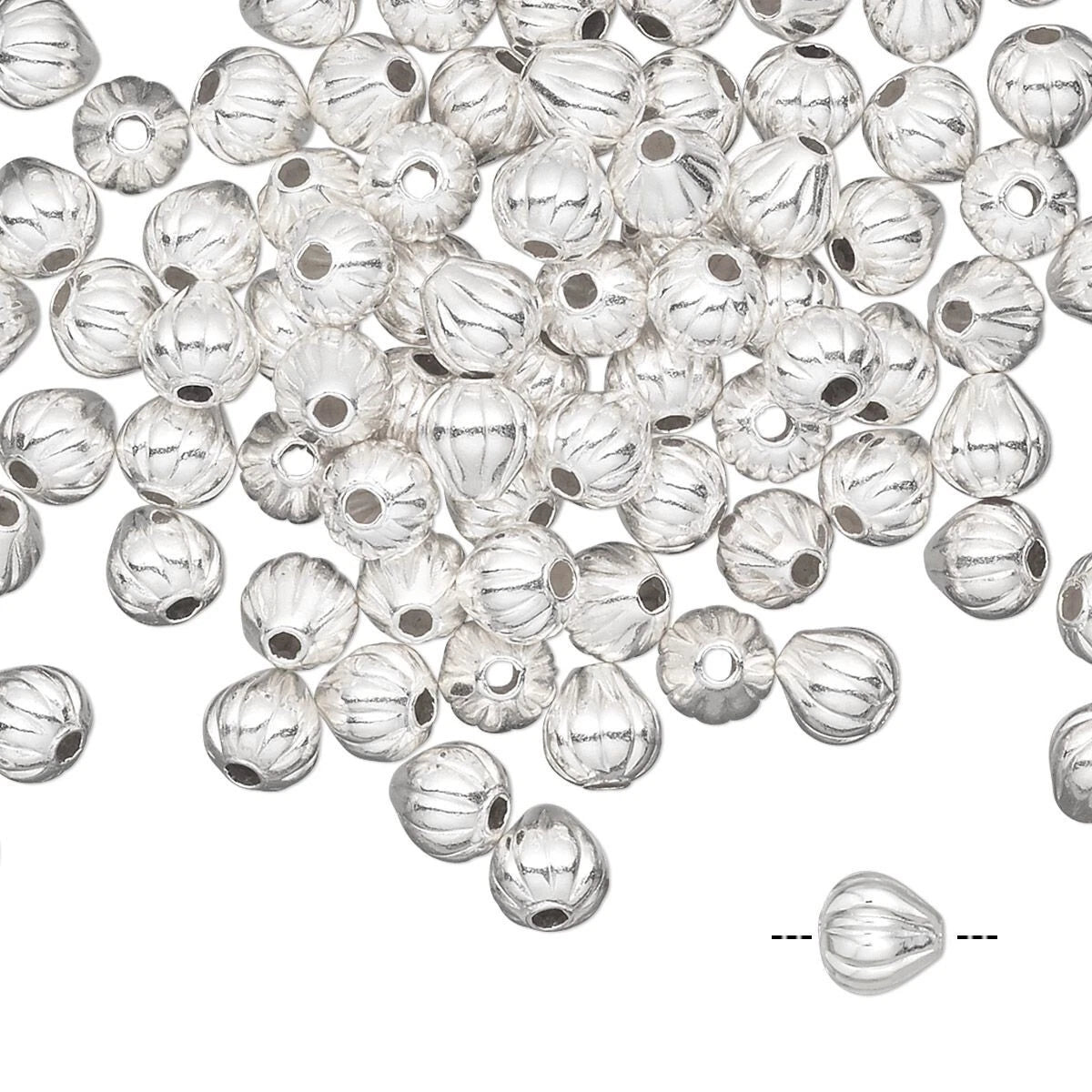A pile of silver metallic conical beads with a ribbed texture and a central hole, shown on a white background with a single bead highlighted at the bottom right.