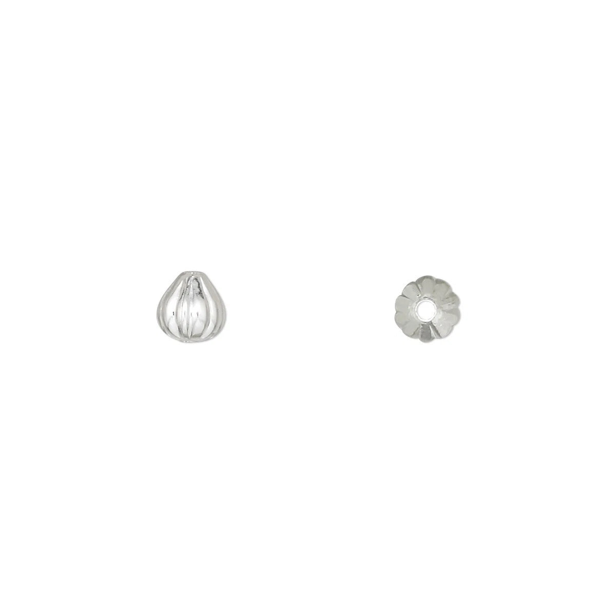 Metal ear spoon on a white background