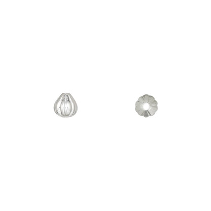 Metal ear spoon on a white background