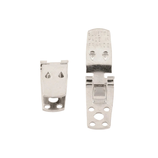 Two silver metal shoe clip hinge brackets on a plain white background, one smaller and one larger, with 'BLUETTE MADE IN FRANCE' stamped on the larger piece.