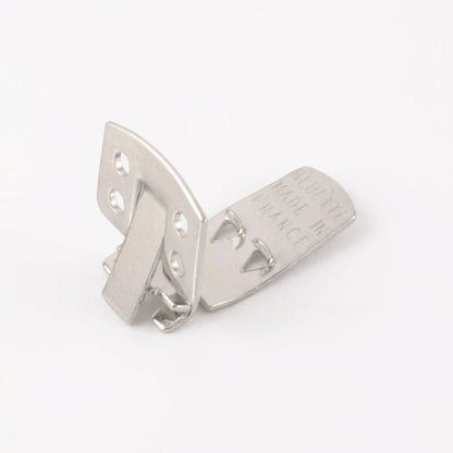 A polished silver metal hinge or latch component with pre-drilled mounting holes and engraved text reading 'BLUETTE MADE IN FRANCE' on one arm, shown on a plain white background.