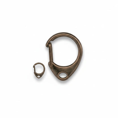 A close-up of a bronze-toned metal carabiner clip with a small matching ring and the text 'Close-up' below, on a plain white background.