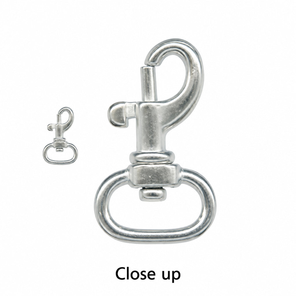 A close-up of a silver metal swivel snap hook with a large D-ring and a smaller separate snap hook shown beside it on a white background.