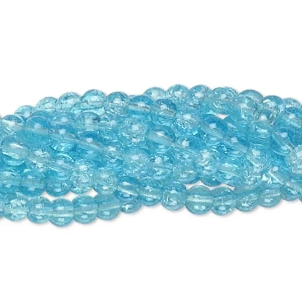 A close-up of a strand of translucent light blue faceted beads on a plain white background.