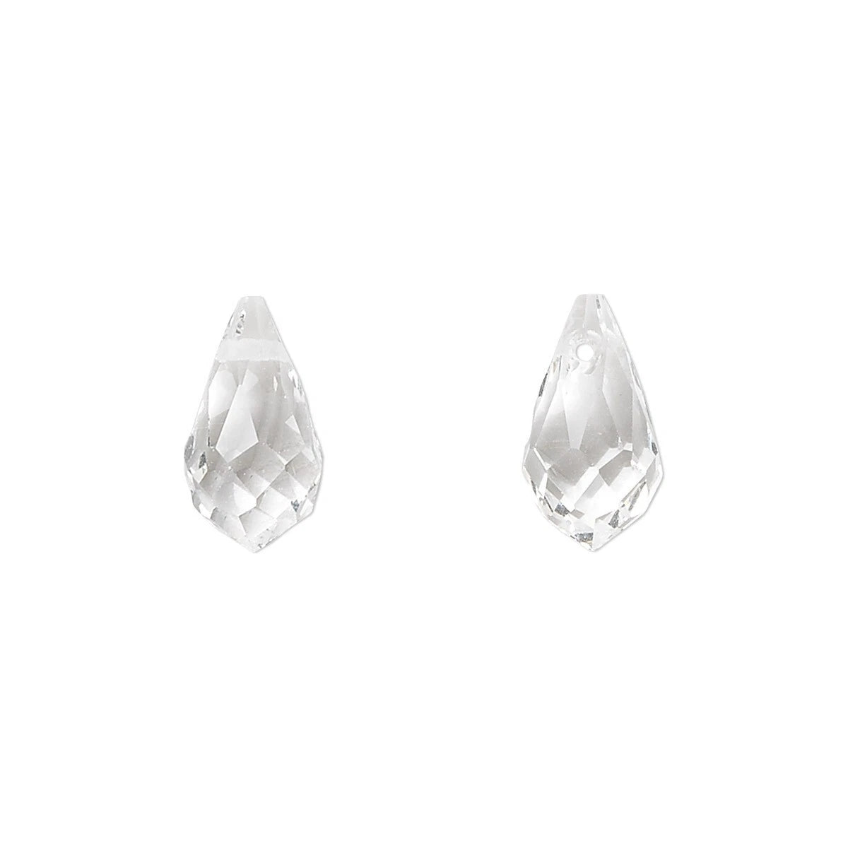 A pair of clear faceted teardrop-shaped crystal beads on a solid white background.