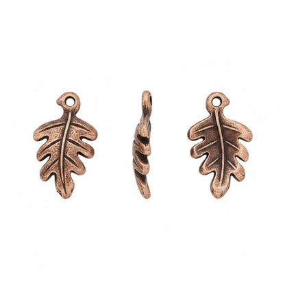 Three small leaf-shaped metal charms with a textured, antiqued bronze finish, shown from front and side views on a plain white background.