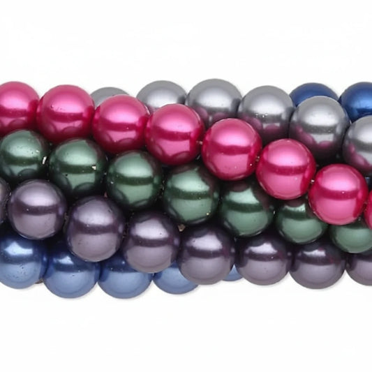 A close-up of strands of glossy, lustrous round beads in multiple colors, including bright pink, dark green, purple, blue, and gray, arranged horizontally against a plain white background.